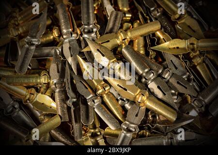 Extreme close-up of a large group of old and vintage pen nibs Stock Photo