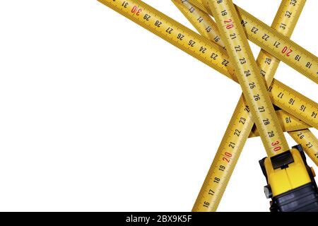 Close-up of a group of tape measures, meter, isolated on white background Stock Photo