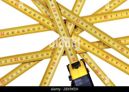 Close-up of a group of tape measures, meter, isolated on white background Stock Photo