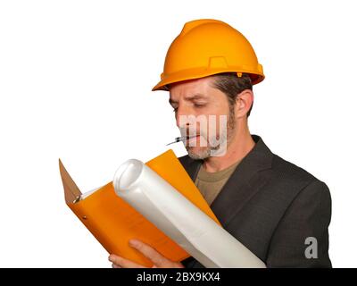 corporate portrait of young attractive and successful industrial engineer or architect in safety builder helmet checking building project blueprint ha Stock Photo