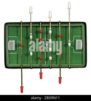 Top view of a mini table football game with an old black and white soccer ball. Isolated on white background Stock Photo