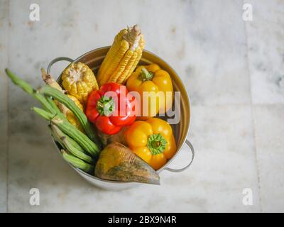 Basket with fresh healthy organic vegetables isolated on white background Stock Photo