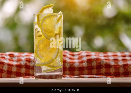 Citrus lemonade in garden setting, summer drink