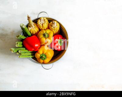 Basket with fresh healthy organic vegetables isolated on white background Stock Photo