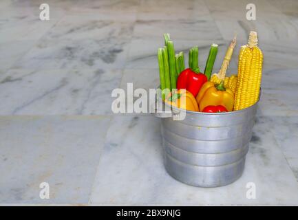 Basket with fresh healthy organic vegetables isolated on white background Stock Photo