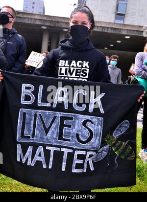A Black Lives Matter protest in central Manchester, England, United Kingdom on June 6, 2020, attended by many thousands of protesters, in solidarity with the protesters in the USA regarding the death of George Floyd. Floyd, an African-American man, died in Minneapolis, Minnesota, United States, on May 25, 2020,  while being arrested by 4 police officers after a shop assistant alleged he tried to pay with a counterfeit $20 bill. Stock Photo