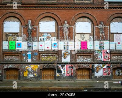 Berlin/Germany - April 21, 2014 : Street art and posters on historic building Stock Photo