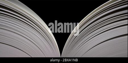 Open book with open pages on both sides. Wide image, isolated on black Stock Photo