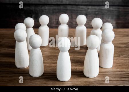 A business or social concept of generic figures grouped into a circle during a meeting, conference or forum discussing various topics. Stock Photo