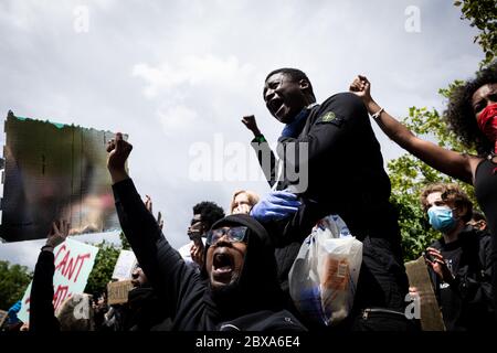 Manchester, UK. 06th June, 2020. A protester acting out being strangled and not able to breach takes part in a protest against the police brutality in America. Credit: Andy Barton/Alamy Live News Stock Photo