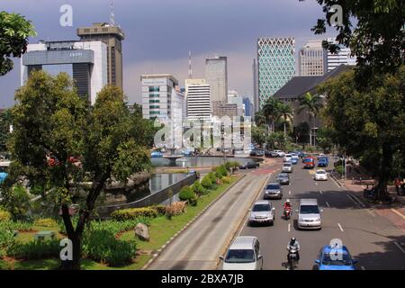 JAKARTA, INDONESIA - May 30, 2013: Jalan Medan Merdeka, in the center Jakarta city center on a sunny day. In the Middle of financial district, close t Stock Photo