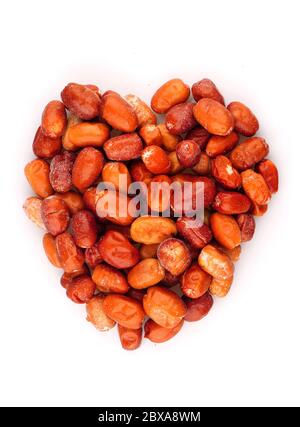 Organic dried ripe dates in heart symbol isolated on white background Stock Photo