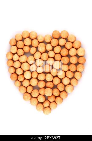 Organic Spicy, covered chickpea in heart symbol isolated on white background Stock Photo