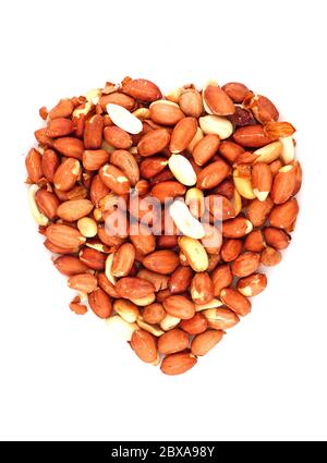 Organic unsalted Peanuts in heart symbol isolated on white background. Stock Photo