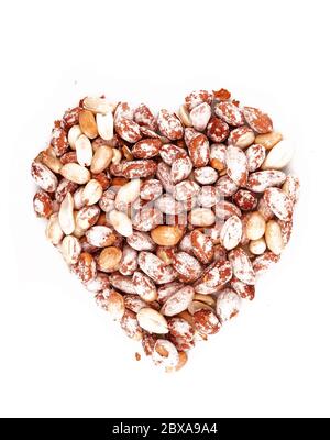 Organic Salted Peanuts in heart symbol isolated on white background Stock Photo