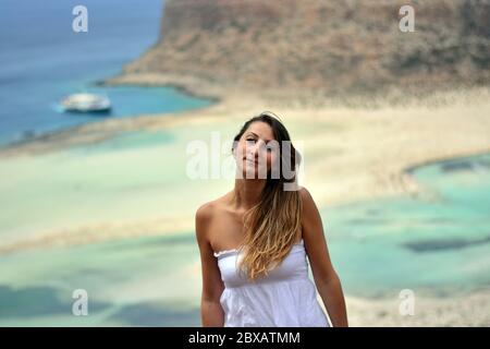 the beautiful woman in front of the lagoon Stock Photo