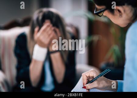 Psychotherapist in session with mental health patient Stock Photo
