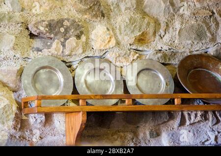 ancient cuisine, cooking tools and medieval medicine traditional tools of the ancient kitchen, cooking in the countryside with dishes, metal, trays, i Stock Photo