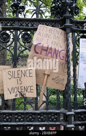 Placards are displayed on the Houses of Parliament railings during the rally in London, UK, against racism and the killing of George Floyd in US. Stock Photo