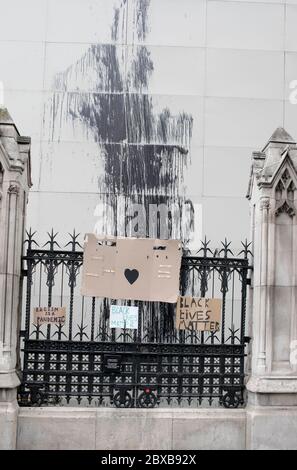 Placards are displayed on the Houses of Parliament railings during the anti racist protest held in central London. Stock Photo