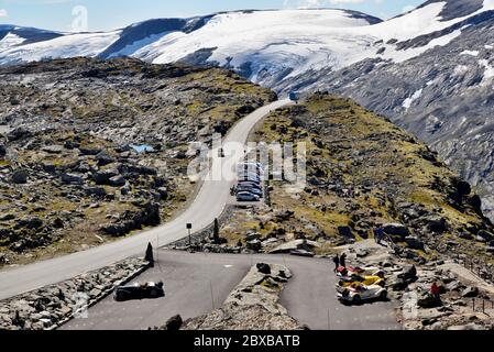 Dalsnibba is a mountain approximately 1500m above sea level, overlooking Geirangerfjord, Norway. There appears to be a car rally in the car park. Stock Photo