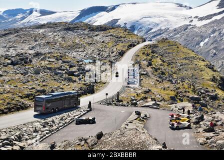 Dalsnibba is a mountain approximately 1500m above sea level, overlooking Geirangerfjord, Norway. There appears to be a car rally in the car park. Stock Photo