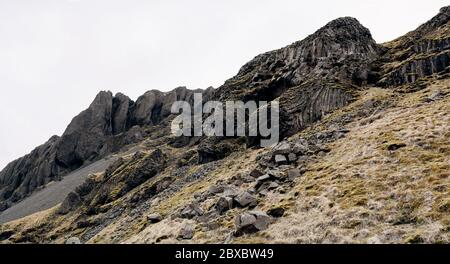 A close-up of the texture of the mountains in Iceland. Basalt volcanic rocks, puff stones covered with moss. Stock Photo