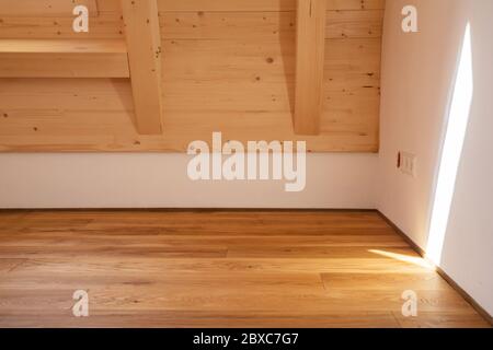 Luxury oak parquet flooring after applying of oil-based floor finish, which tend to enhance the appearance of parquet Stock Photo