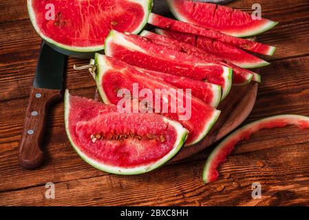 Watermelon slices lying on the cutting board Stock Photo
