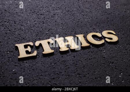 Ethics. Motivational internet business words quotes, wooden lettering typography concept on black background Stock Photo