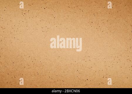 Sheet of brown paper or cardboard texture for background. Stock Photo
