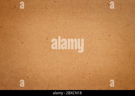 Sheet of brown paper or cardboard texture for background. Stock Photo
