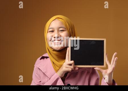 Cute Young Malay Girl Wearing Traditional Baju Kurung Kissing Her ...