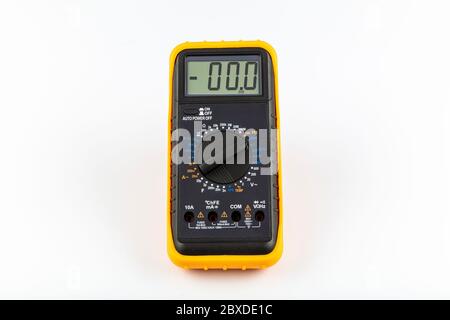 Multimeter for a measurement of a voltage, current and resistance with cables. Digital multimeter to check the resistance on a white background. Stock Photo