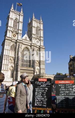 London, UK - April 27, 2011:  A bookmaker from the betting firm Ladbrokes hoping to take punts from gamblers on the Royal Wedding of Prince William an Stock Photo