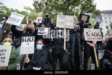 Manchester, UK. 06th June, 2020. Protesters hold BLM placards during the demonstration.Thousands of people attend the most recent 'Black Lives Matter' protest in Manchester's city centre following the death of George Floyd in the USA. Credit: SOPA Images Limited/Alamy Live News Stock Photo