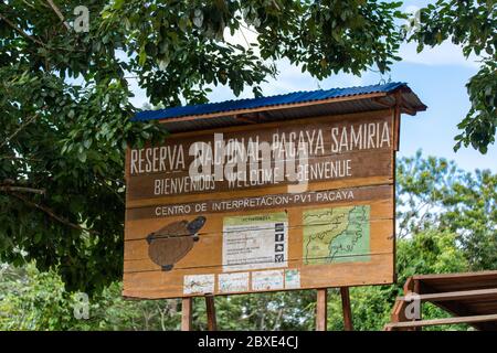Large wooden sign marks the entrace to the Pacaya-Samiria National Reserve on the Amazon River in Peru Stock Photo
