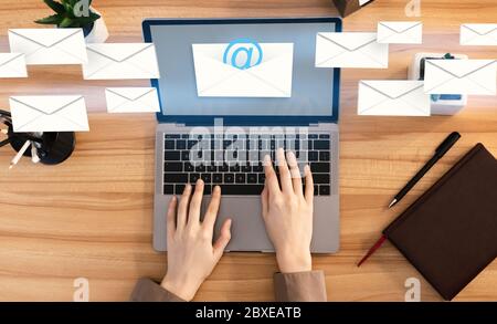 Business Correspondence Concept. Creative Collage Of Unrecognizable Woman Sending Email At Work Stock Photo