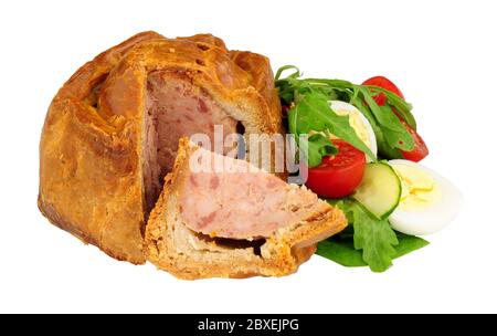 Crusty handmade savoury pork pie with salad and boiled egg isolated on a white background Stock Photo