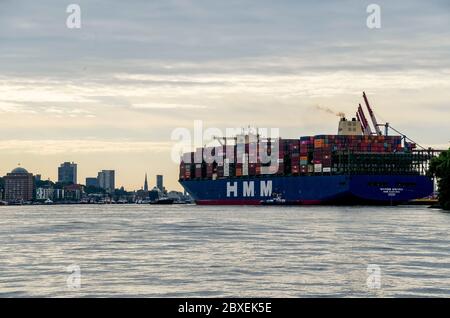 Hamburg, Germany. 07th June, 2020. The world's largest container ship 'HMM Algeciras' is entering the port of Hamburg on its maiden voyage. Credit: Axel Heimken/dpa/Alamy Live News Stock Photo