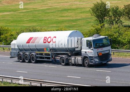 Linde plc global multinational chemical company articulated Haulage delivery trucks, BOC gases lorry trailer, transportation, truck, cargo carrier, DAF vehicle, European commercial transport industry travelling on M6 at Manchester, UK Stock Photo