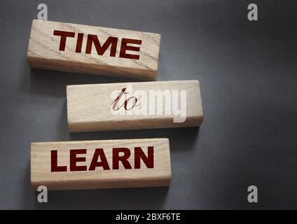 Time to Learn on wooden blocks put black. Education concept. Life-time learning business concept Stock Photo