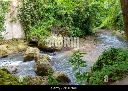 black river that comes from the marmore waterfalls in the middle of nature Stock Photo