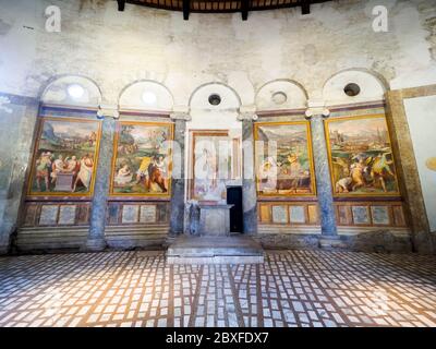 Walls decorated with frescoes portraying scenes of martyrdom in the Basilica di Santo Stefano Rotondo al Celio - Rome. Italy Stock Photo