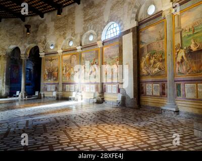 Walls decorated with frescoes portraying scenes of martyrdom in the Basilica di Santo Stefano Rotondo al Celio - Rome. Italy Stock Photo