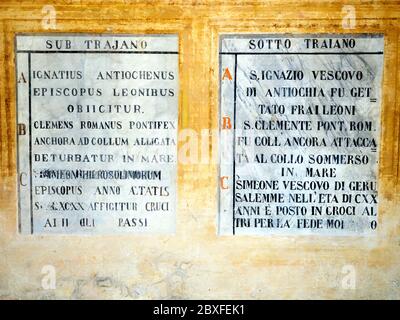 Fresco writings in Latin and old Italian describing the martyrdom of St. Ignatius, St. Clement and the bishop Simeone under the reign of the Emperor Trajan - Basilica di Santo Stefano Rotondo al Celio - Rome. Italy Stock Photo