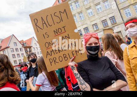 Wroclaw, Poland, 06.06.2020 - Young people hold a poster with words 'racism is not only american problem' on polish peaceful protest against racism an Stock Photo