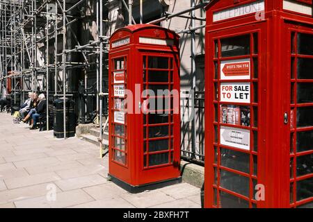 Newly painted Red Telephone Boxes for sale or To Let in Preston City Centre Stock Photo