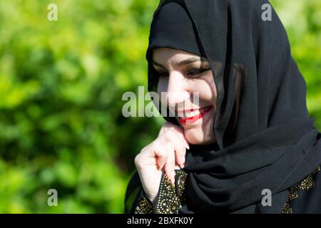 Beautiful young muslim woman smiles broadly. Stock Photo