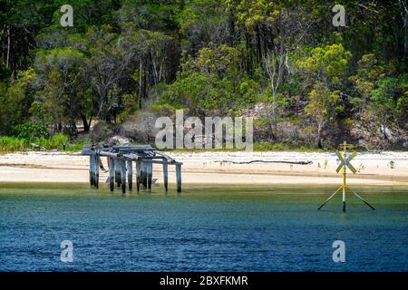 The remains of the MacKenzies Landing timber loading jetty, North White Cliffs, Fraser Island, Queensland Australia Stock Photo